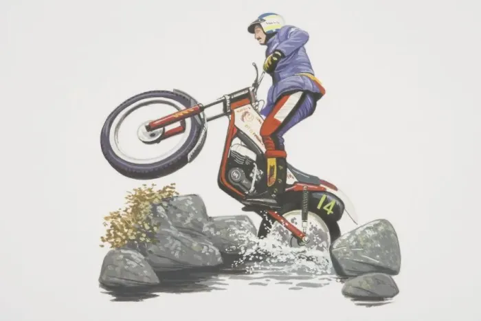 Framed Print : Motorcycle rider performing a wheelie while negociating rocks and water, low angle side view Framed Print : Motorcycle rider performing a wheelie while negociating rocks and water, low angle side view