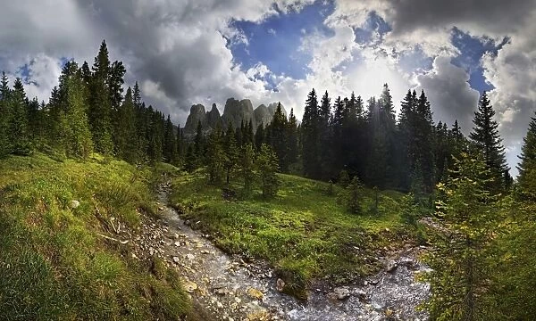 Mountain forest with a small creek, Geisler Group, Odle Mountains at Ranui, Santa Maddalena, Villnoess or Funes Valley, Dolomites, South Tyrol, Italy, Europe