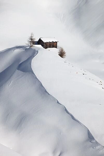 Mountain hut in snow