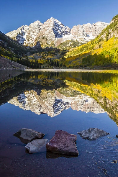 Mountain lake reflections in autumn sunrise, Maroon Bells, Colorado, USA