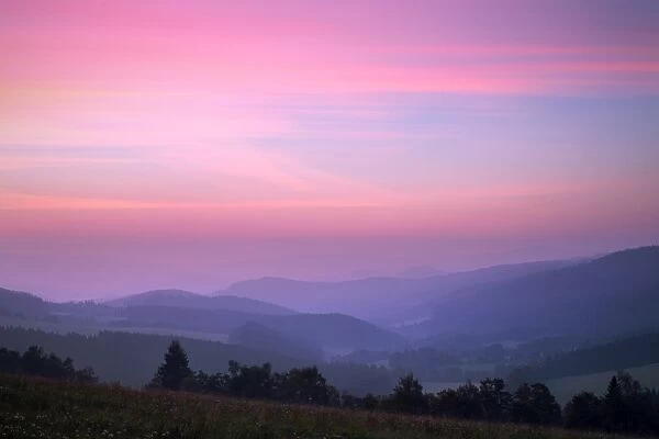 Mountain layers view during daybreak (dawn)