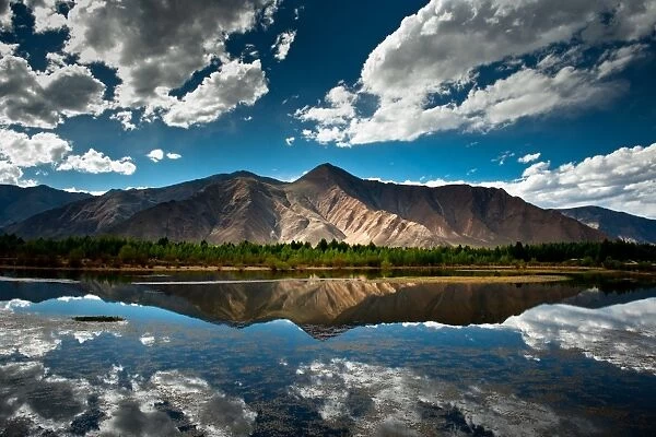 Mountain range in Tibet with its reflection