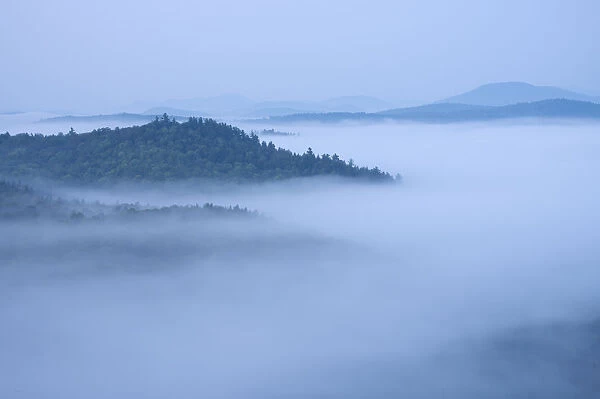Mountains enshrouded in morning fog, Adirondack Mountains, New York State, USA