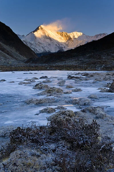 Mountains overlooking frozen valley