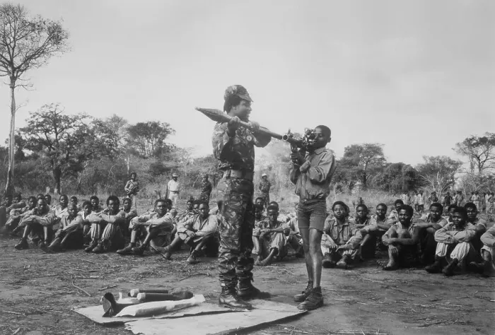 Framed Print : Mozambican Soldier Instructing Youngsters on Rocket Launching Framed Print : Mozambican Soldier Instructing Youngsters on Rocket Launching
