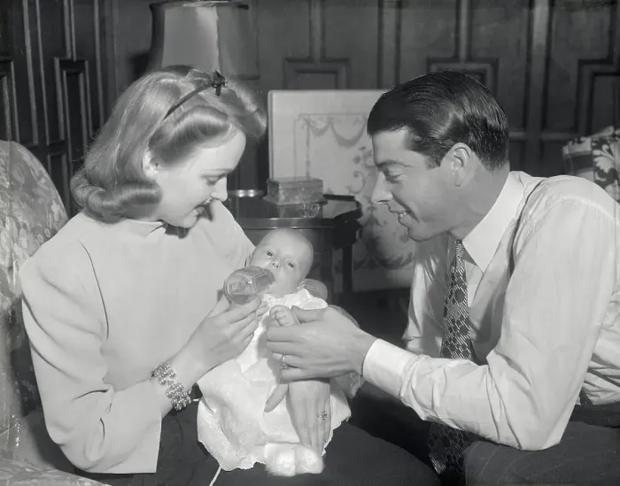 Framed Print : Mr. and Mrs. Joe DiMaggio with Their Infant Son