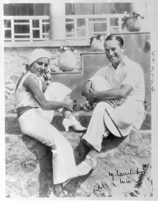 Framed Print : Mr. and Mrs. Maurice Chevalier Sitting by Sidewalk Framed Print : Mr. and Mrs. Maurice Chevalier Sitting by Sidewalk