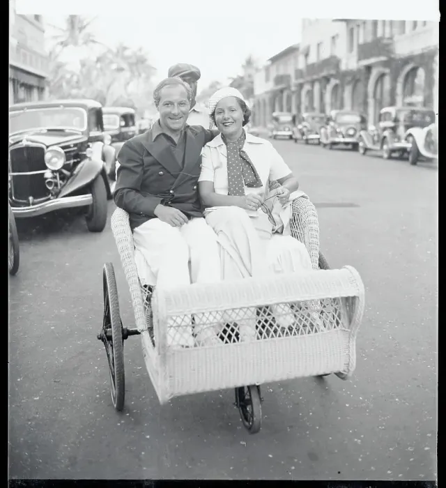 Framed Print : Mr. and Mrs.George Jessel Sitting in a Beach Chair Framed Print : Mr. and Mrs.George Jessel Sitting in a Beach Chair