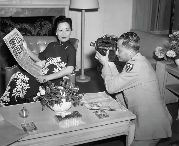 Framed Print : Mrs. Chiang Kai-Shek Holds Paper For Pho Framed Print : Mrs. Chiang Kai-Shek Holds Paper For Pho