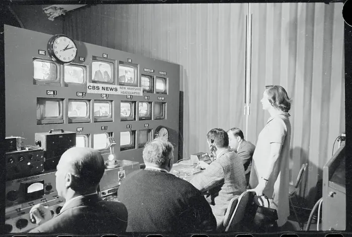 Framed Print : Mrs. Nelson Rockefeller Observing Husband on Television