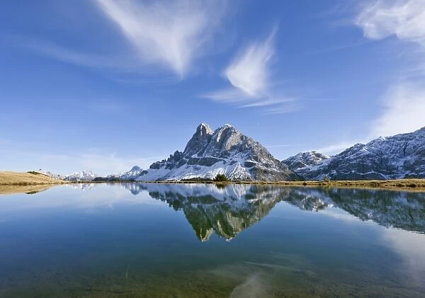 Mt Peitlerkofel or Sas de Puetia, 2875m, is reflected in a lake near Enzian Hut, Plose, South Tyrol, Italy, Europe