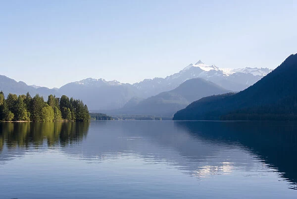 Mt. Shuksan reflected in morning light on calm Baker Lake, Washington State, USA