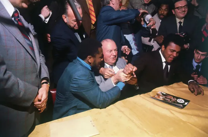 Framed Print : Muhammad Ali Clenching Fists with Joe Frazier