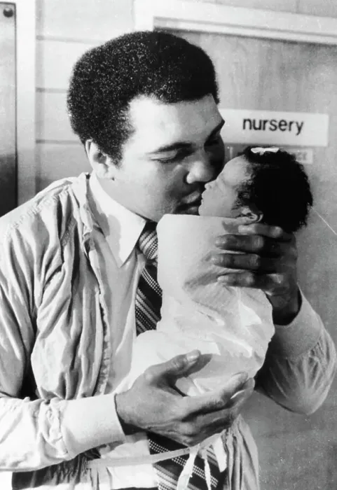 Framed Print : Muhammad Ali Kissing His Baby Daughter Framed Print : Muhammad Ali Kissing His Baby Daughter