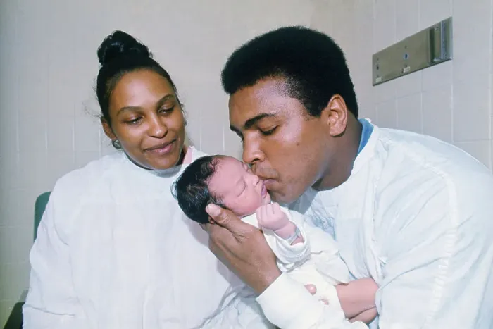 Framed Print : Muhammad Ali Kissing His Newborn Son Framed Print : Muhammad Ali Kissing His Newborn Son