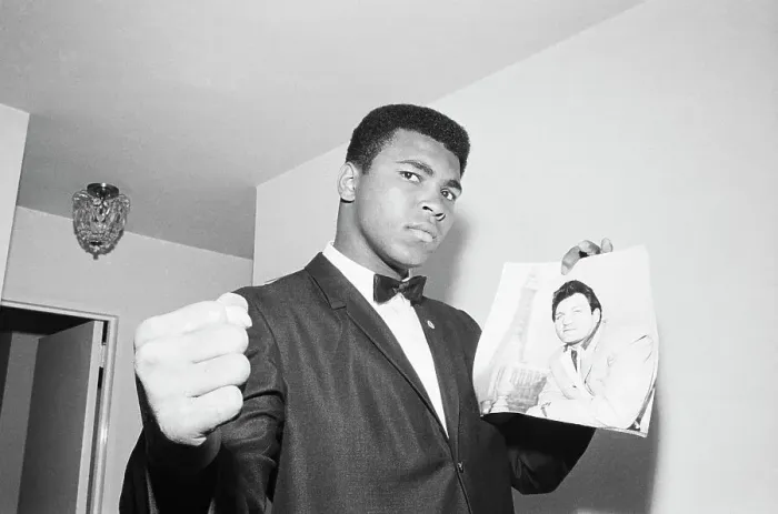 Framed Print : Muhammad Ali with Picture of Opponent Framed Print : Muhammad Ali with Picture of Opponent