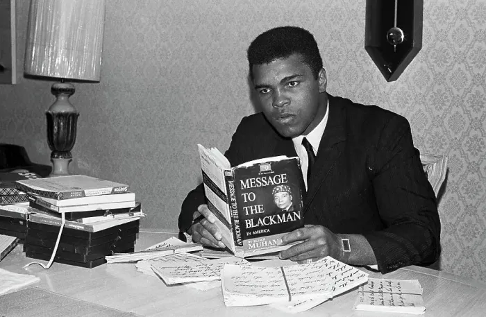 Framed Print : Muhammad Ali Reading a Book Framed Print : Muhammad Ali Reading a Book