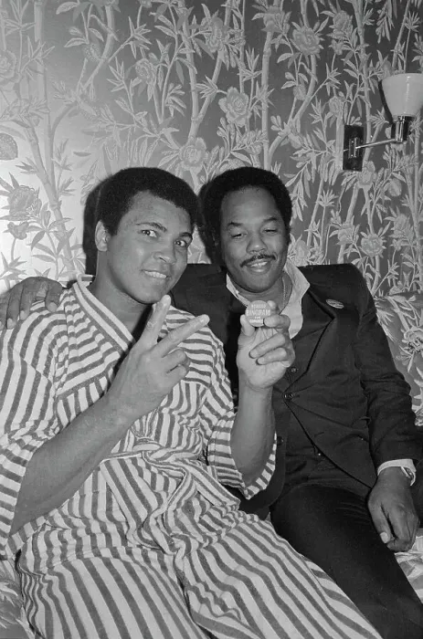 Framed Print : Muhammad Ali in Robe and Sitting With Friend Framed Print : Muhammad Ali in Robe and Sitting With Friend