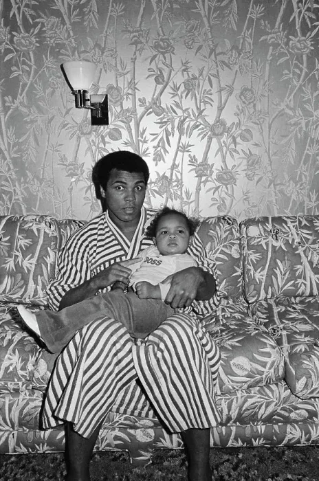 Framed Print : Muhammad Ali Sitting on Couch With Baby Framed Print : Muhammad Ali Sitting on Couch With Baby