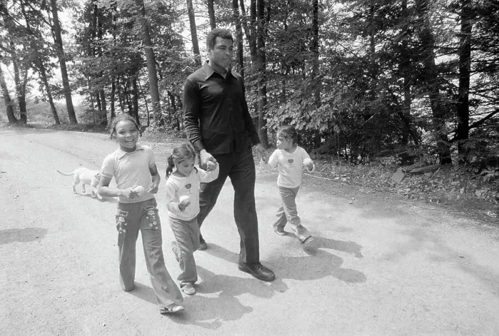Framed Print : Muhammad Ali Walking with Twin Daughters Framed Print : Muhammad Ali Walking with Twin Daughters