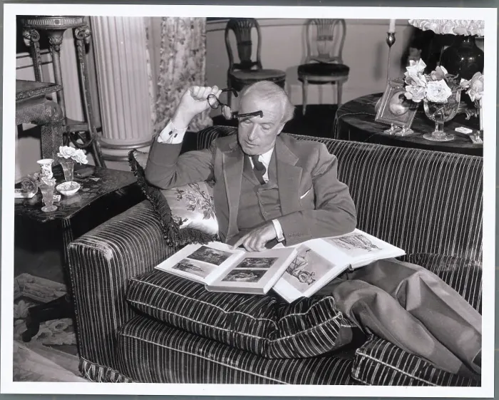 Framed Print : Multi Talented Cecil Beaton Reading While Poised on His Couch