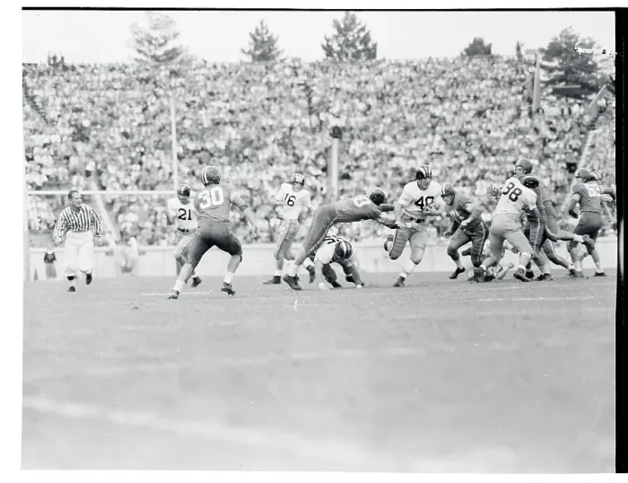Framed Print : Bill Murakowski Avoiding a Tackle