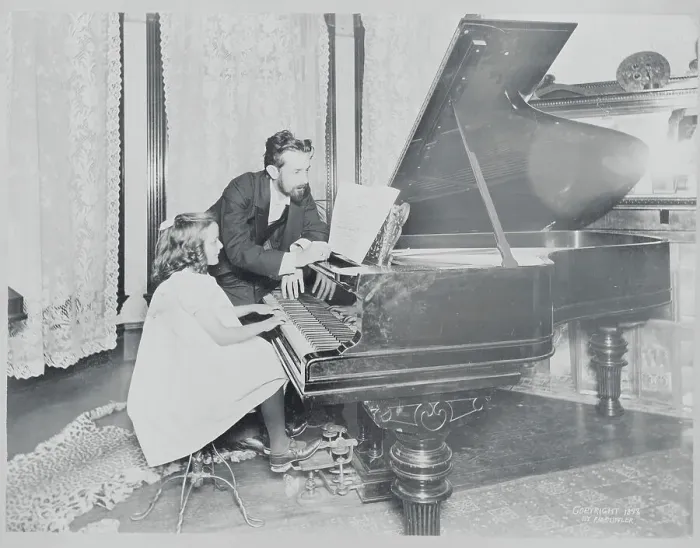 Framed Print : Music Teacher with Student at the Piano Framed Print : Music Teacher with Student at the Piano