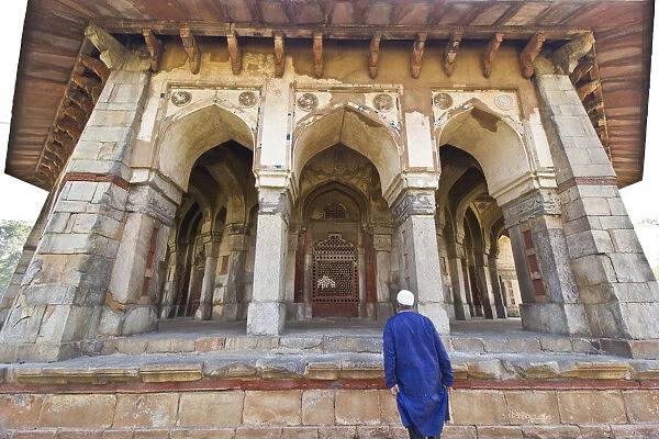 Muslim Tourist entering the gate of Isa Khan Niyazis Tomb