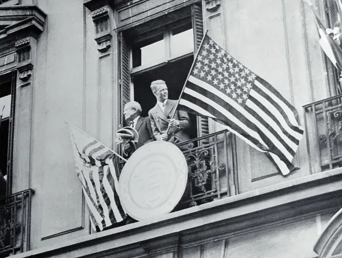 Framed Print : Myron T. Herrick and Charles Lindbergh Waving Flag in Window Framed Print : Myron T. Herrick and Charles Lindbergh Waving Flag in Window