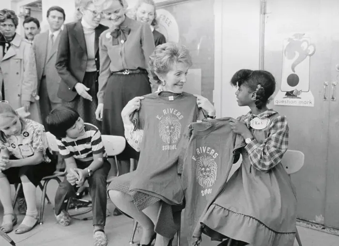 Framed Print : Nancy Reagan Holding Shirt with Student Framed Print : Nancy Reagan Holding Shirt with Student