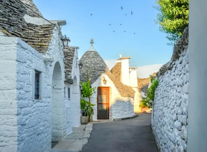 Framed Print : Narrow alley with trulli houses in Alberobello Framed Print : Narrow alley with trulli houses in Alberobello