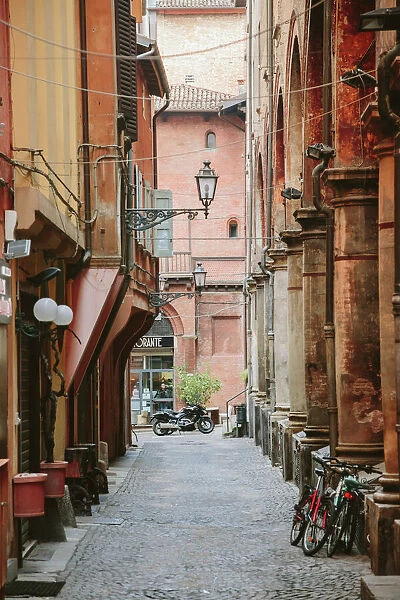 Narrow street in the old town of Bologna, Emilia-Romagna, Italy