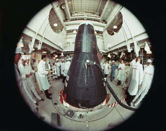 Framed Print : NASA Technicians Working by a Space Capsule Framed Print : NASA Technicians Working by a Space Capsule