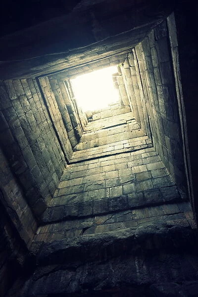 Natural light entering top of Angkor temple ruins