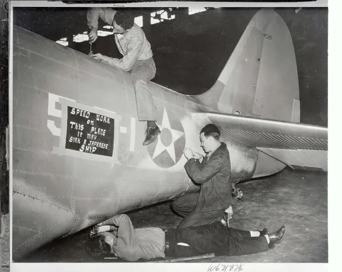 Framed Print : Naval Employee Working on Airplane Framed Print : Naval Employee Working on Airplane
