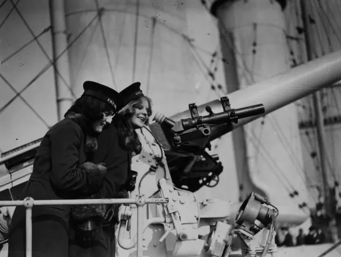 Framed Print : Naval Gun. 1929: Two women look at a gun on board HMS London Framed Print : Naval Gun. 1929: Two women look at a gun on board HMS London