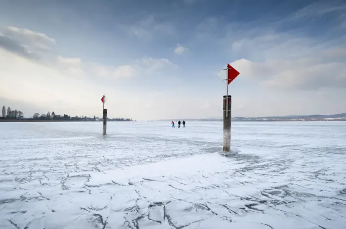 Framed Print : Navigation mark on a frozen Lake Constance with skaters, island auf Reichenau, Konstanz district, Baden-Wuerttemberg, Germany, Europe Framed Print : Navigation mark on a frozen Lake Constance with skaters, island auf Reichenau, Konstanz district, Baden-Wuerttemberg, Germany, Europe