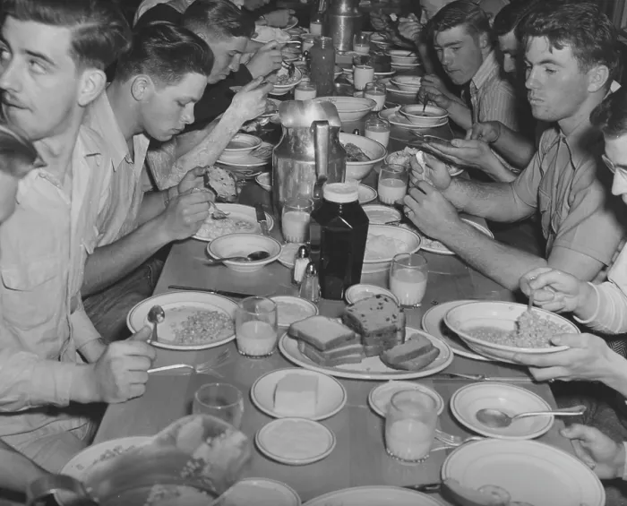 Framed Print : Navy Food. US Navy sailors sitting at a table eating food, circa 1940s Framed Print : Navy Food. US Navy sailors sitting at a table eating food, circa 1940s