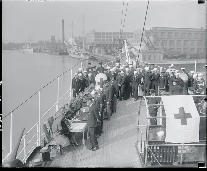 Framed Print : Navy Men Being Signed by Red Cross