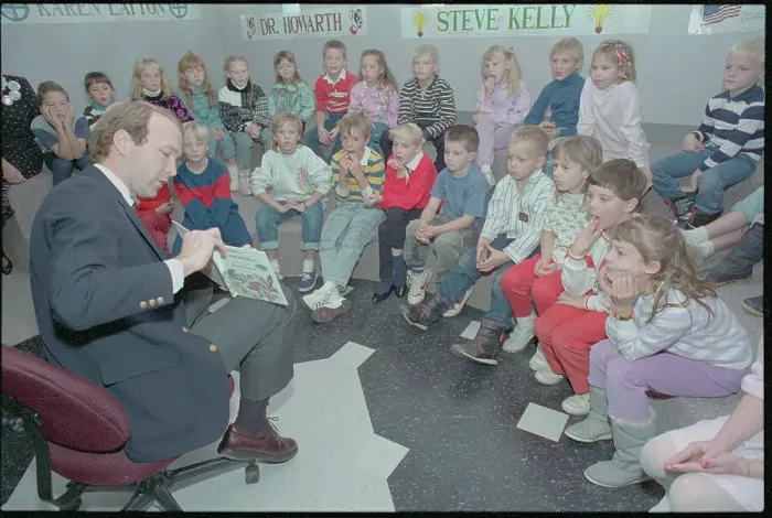 Framed Print : Neil Bush Reading to Children Framed Print : Neil Bush Reading to Children