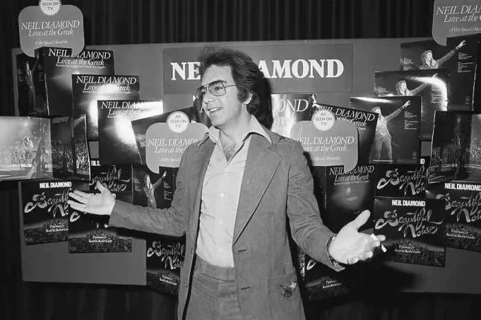 Framed Print : Neil Diamond in Front of Album Display Framed Print : Neil Diamond in Front of Album Display