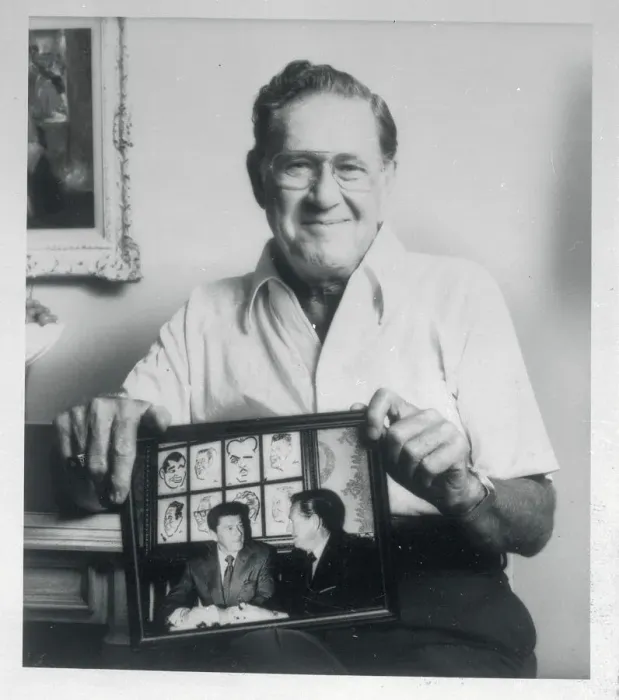 Framed Print : Neil Reagan Holding a Photograph Framed Print : Neil Reagan Holding a Photograph