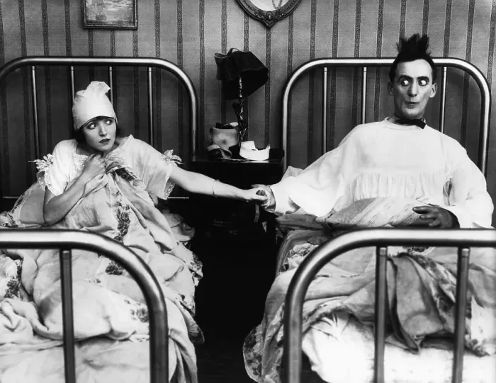 Framed Print : Nervous Couple Holding Hands in Bed Framed Print : Nervous Couple Holding Hands in Bed