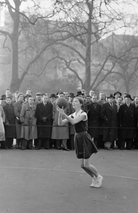 Framed Print : Netball. 2nd January 1954: The crowd watches in anticipation as a netball Framed Print : Netball. 2nd January 1954: The crowd watches in anticipation as a netball