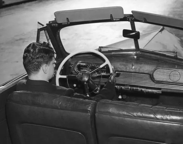 Framed Print : New Hands. A man named Wenger uses his artificial hands to drive his Oldsmobile Framed Print : New Hands. A man named Wenger uses his artificial hands to drive his Oldsmobile