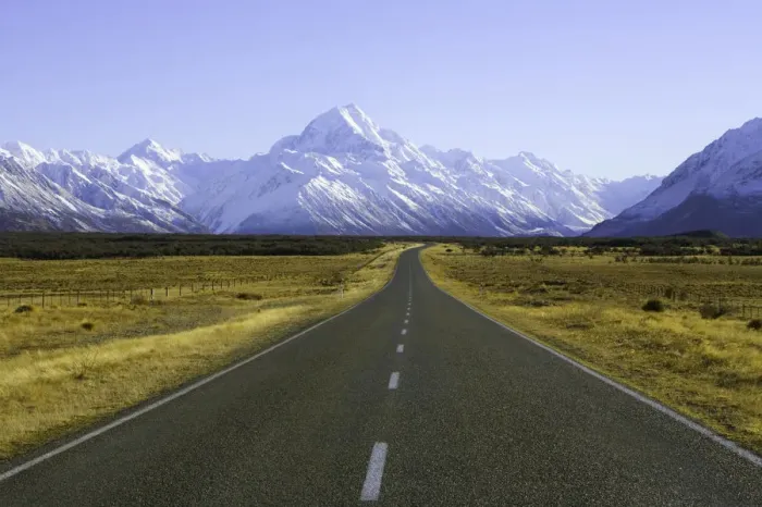 Framed Print : New Zealand, South Island, road with mountains in background, winter Framed Print : New Zealand, South Island, road with mountains in background, winter