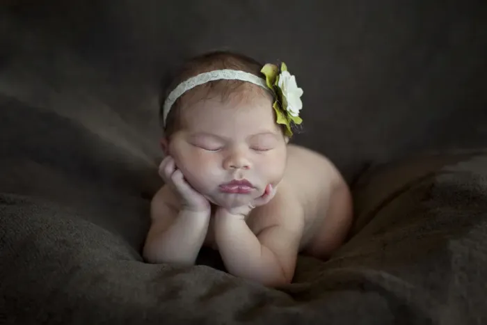 Framed Print : Newborn baby, five days, asleep with head propped up on hands Framed Print : Newborn baby, five days, asleep with head propped up on hands