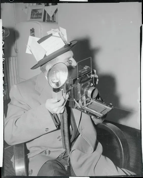 Framed Print : News Photographer Holding His Camera