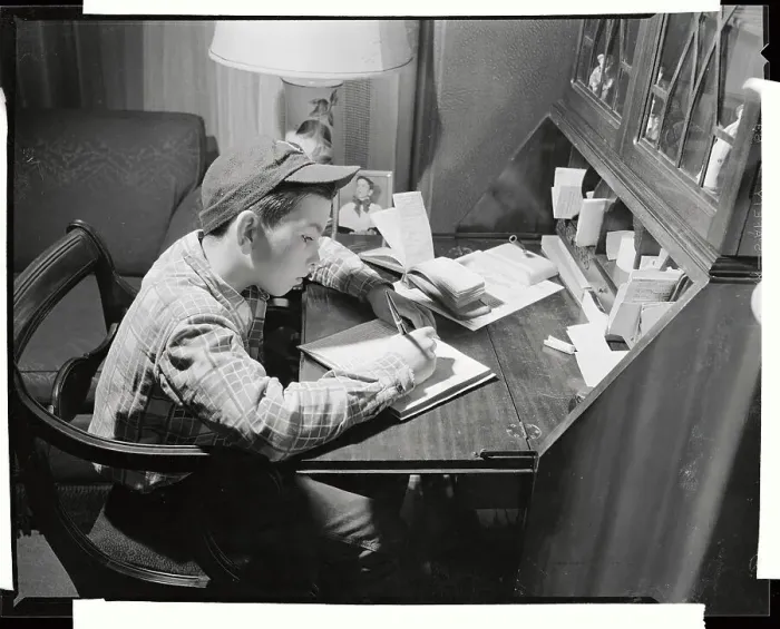 Framed Print : Newsboy Writing Record of Paper Deliveries Framed Print : Newsboy Writing Record of Paper Deliveries