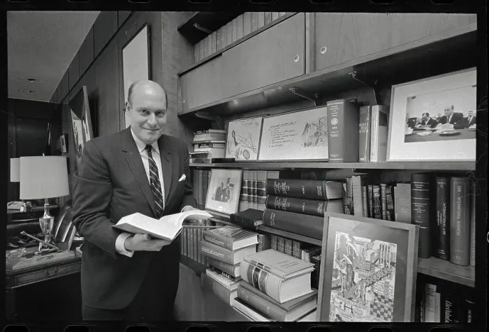Framed Print : Nicholas Katzenbach Flipping Through a Book Framed Print : Nicholas Katzenbach Flipping Through a Book